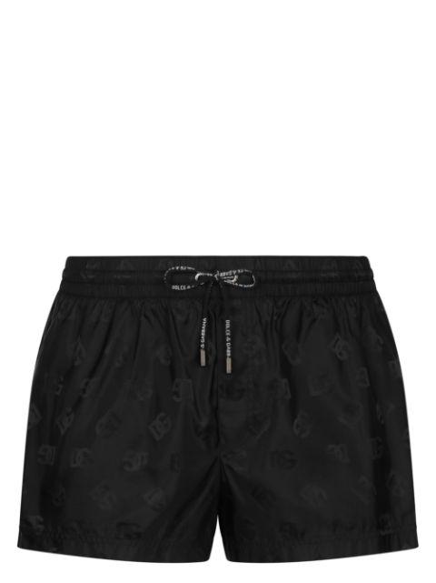 DG monogram-print swim shorts by DOLCE&GABBANA