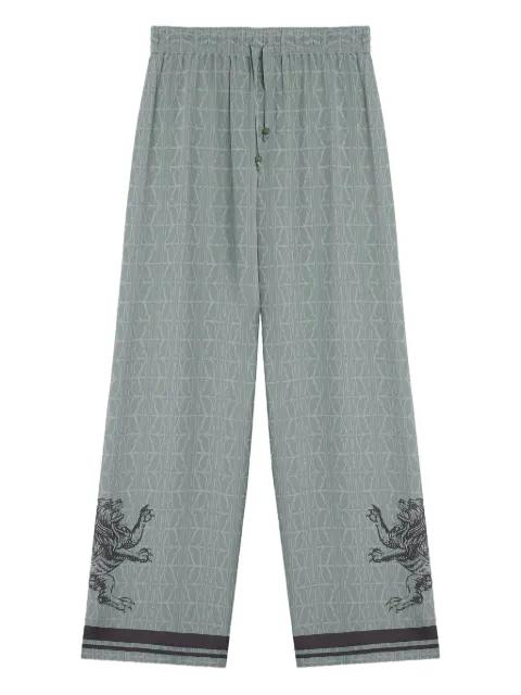 lion-embellished geometric-print pants by DOMAINE DES ARTISTES