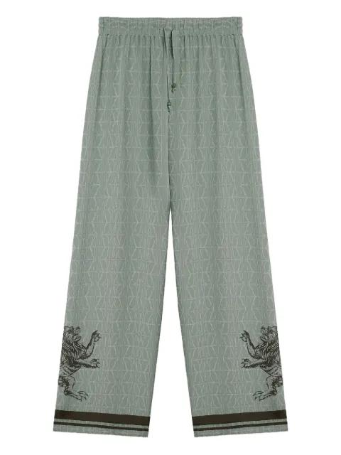 lion-embellished patterned silk trousers by DOMAINE DES ARTISTES