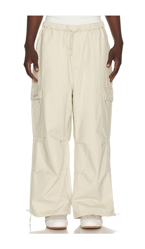 DRMERS CLUB Smiley Logo Parachute Pants in Cream by DRMERS CLUB
