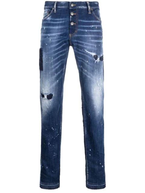 distressed paint splattered jeans by DSQUARED2