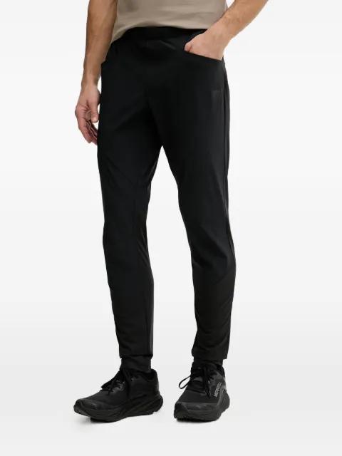 Traverse Hybrid Dynastretch logo-patch track pants by DYNAFIT