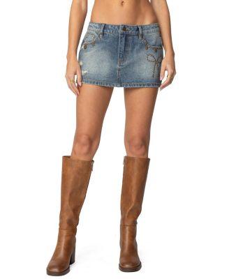 Studded Bow Distressed Denim Mini Skirt by EDIKTED