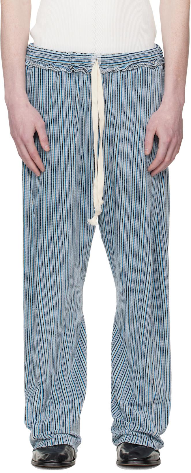Blue Twisted Track Pants by EDWARD CUMING