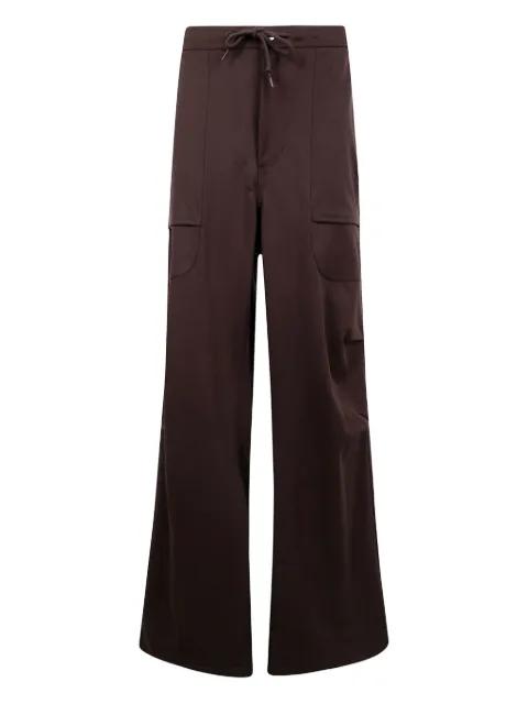 flap-pocket wool trousers by ENTIRE STUDIOS