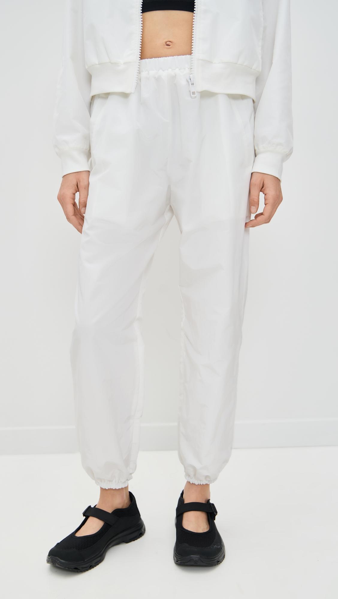 Martina Optic White Tennis Warm-Up Pants With Ankle Side Zippers by EUGENIA KIM LOVE