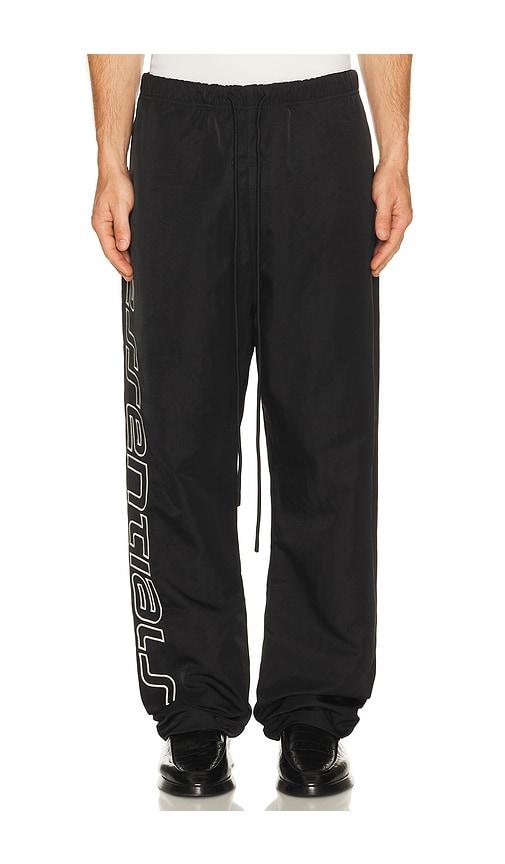 Fear of God ESSENTIALS Active Trace Relaxed Drawstring Pant in Black by FEAR OF GOD