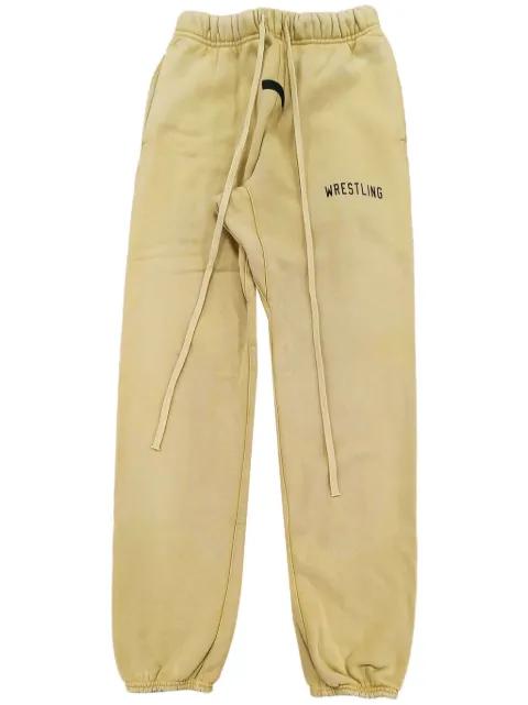 slogan-print track pants by FEAR OF GOD