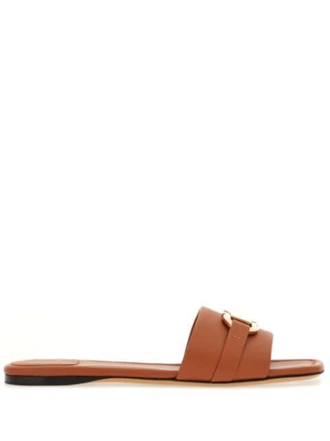 Gancini-buckle leather slides by FERRAGAMO