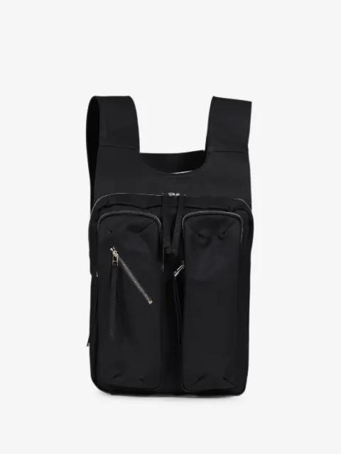 multi-pocket harness-style backpack by FFFPOSTALSERVICE