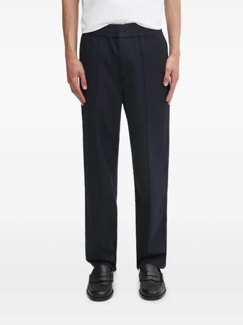 button seam trousers by FILLING PIECES