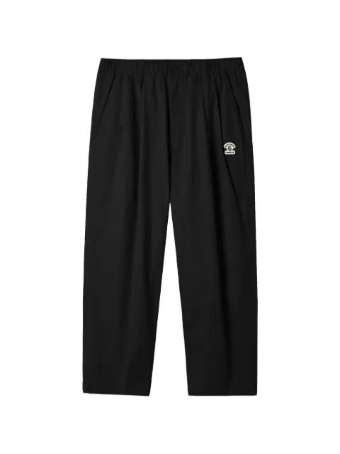 elasticated-waistband logo-patch trousers by FINGERCROXX