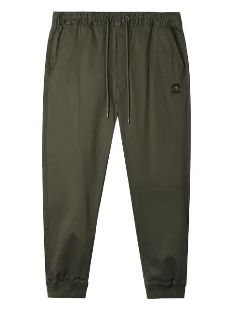 logo-patch cuffed trousers by FINGERCROXX