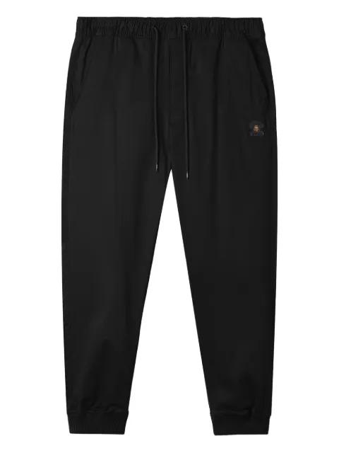 logo-patch cuffed trousers by FINGERCROXX