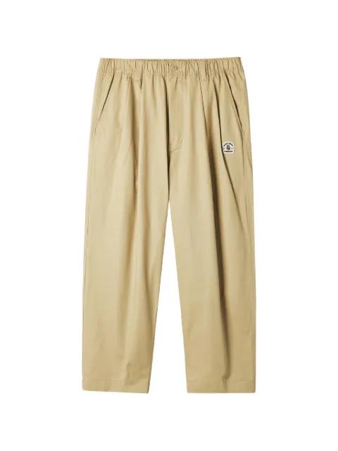 logo-patch trousers by FINGERCROXX