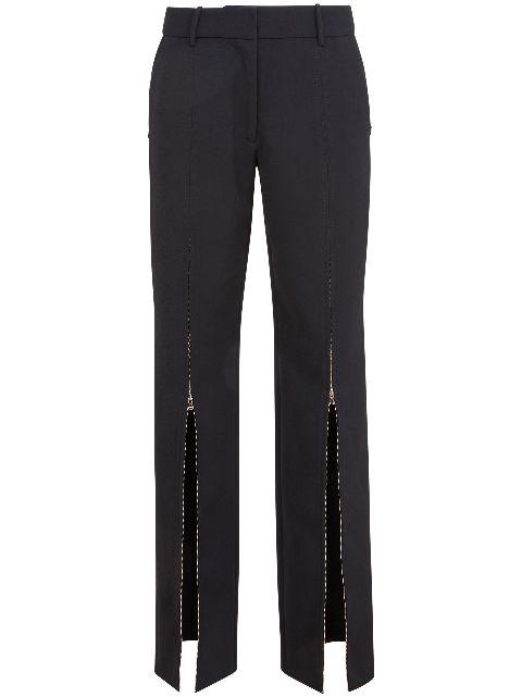 zip-up split trousers by FLEUR DU MAL