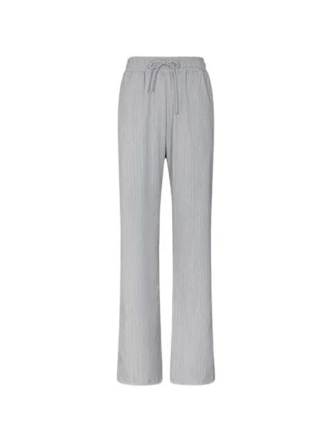 pinstriped track pants by GAELLE PARIS