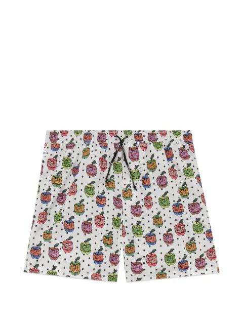 apple-print swim shorts by GCDS