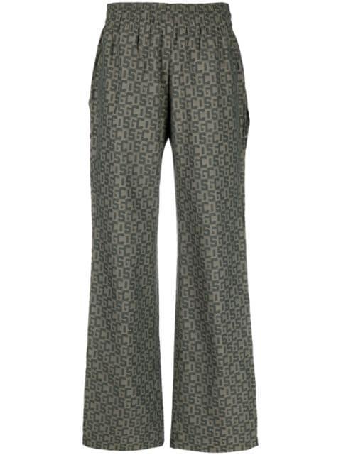 open-leg monogram trousers by GCDS