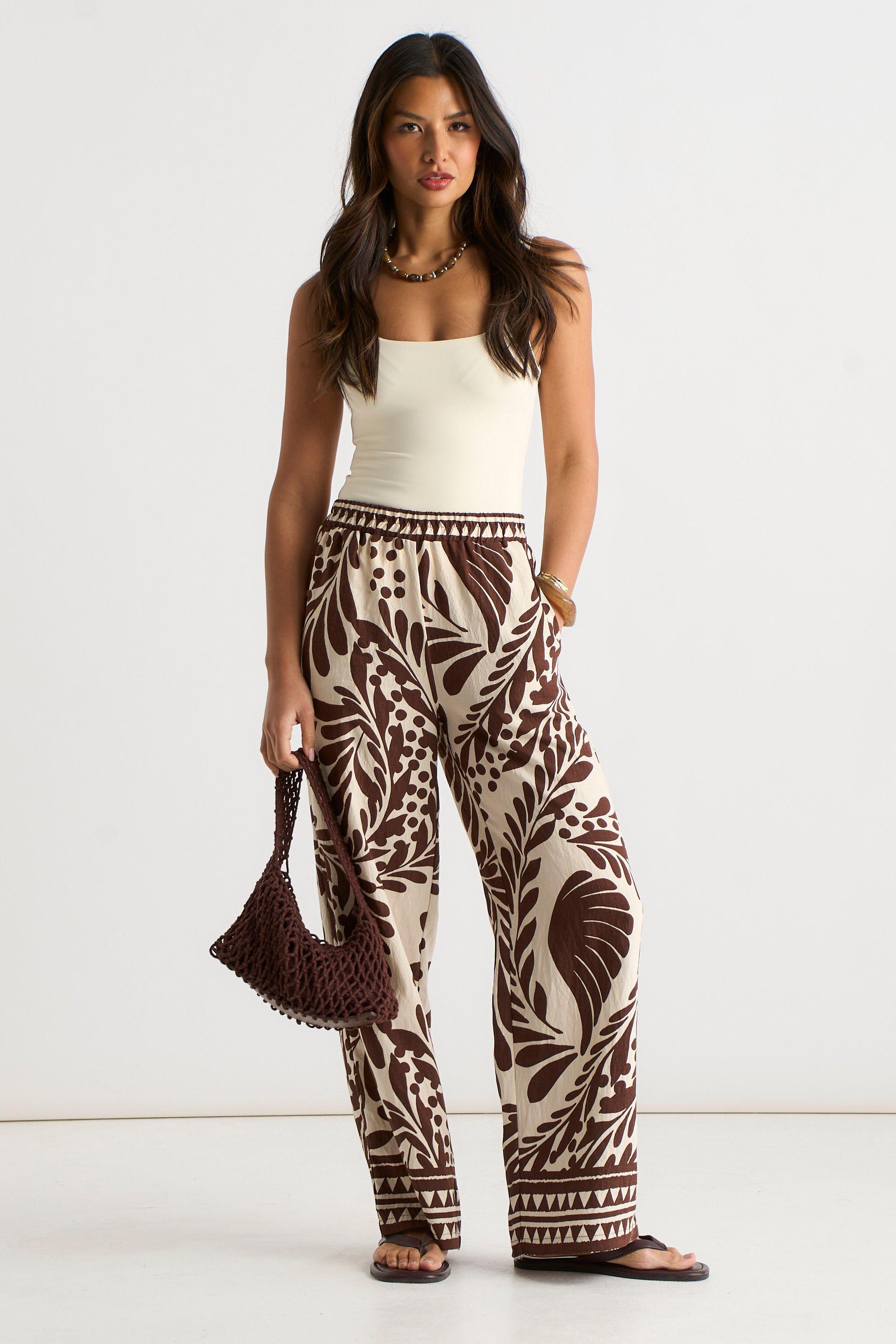 Chocolate Border Print Elasticated Trousers by GINI LONDON