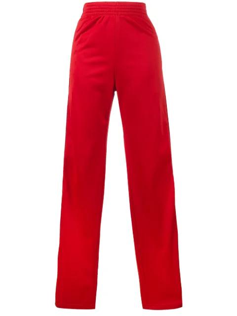 Red logo stripe track pants by GIVENCHY