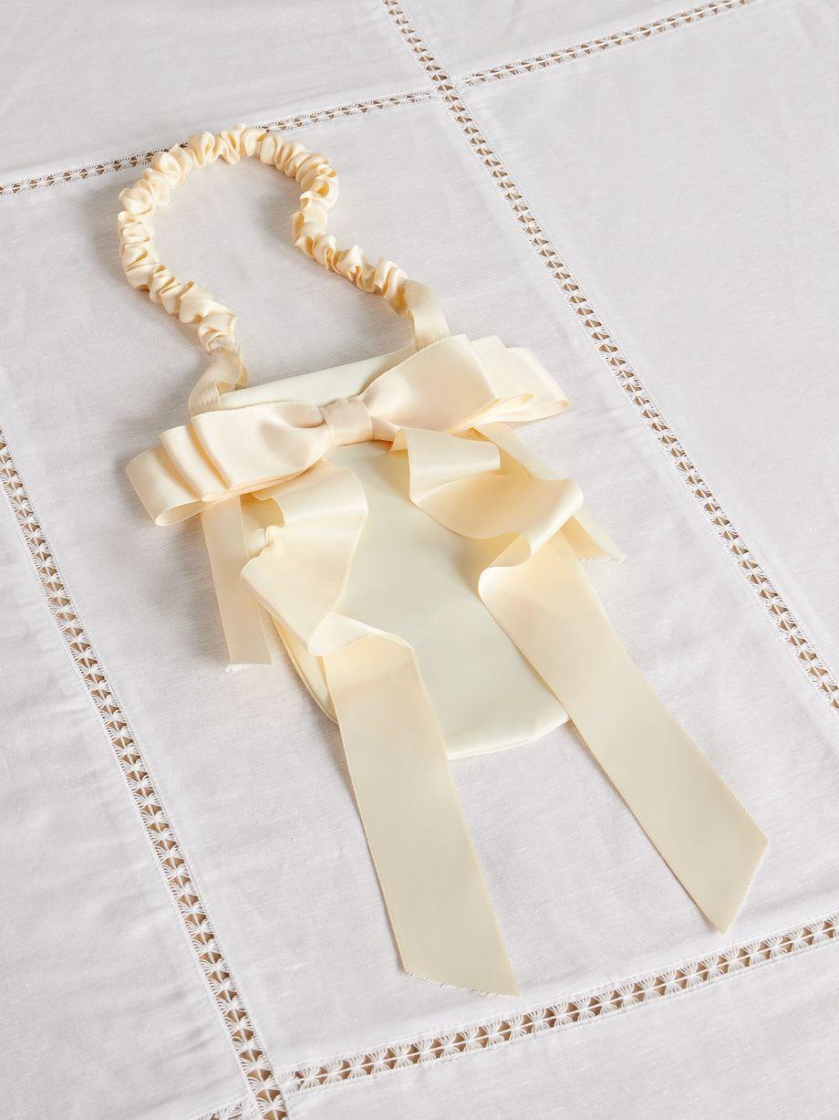 Demi bow-embellished satin baguette pouch by GOHAR WORLD