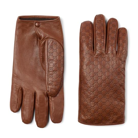 Embossed GG leather gloves by GUCCI