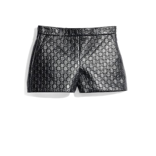 Embossed GG leather shorts by GUCCI