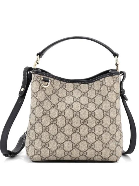 GG Emblem GG Coated Canvas Small bucket bag by GUCCI 