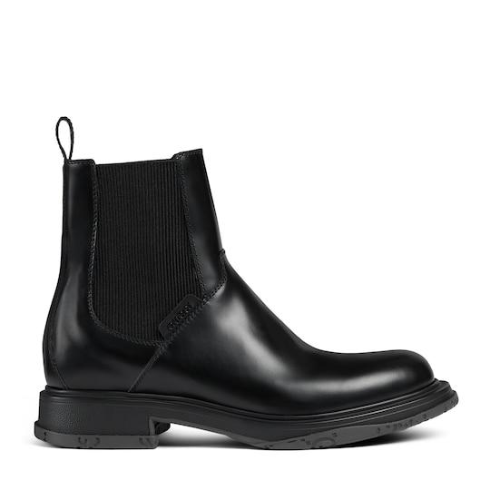 Men's ankle boot with tonal logo by GUCCI