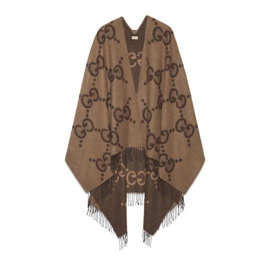 Reversible jumbo GG cashmere cape in beige and dark brown by GUCCI