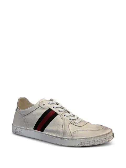 Stretch stripe-detail logo-embossed leather sneakers by GUCCI