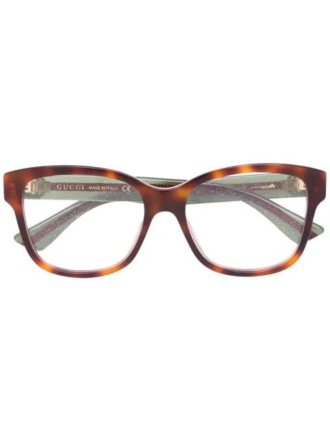 Web arm tortoiseshell glasses by GUCCI