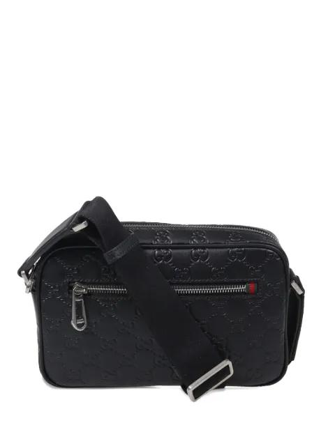 embossed messenger bag by GUCCI
