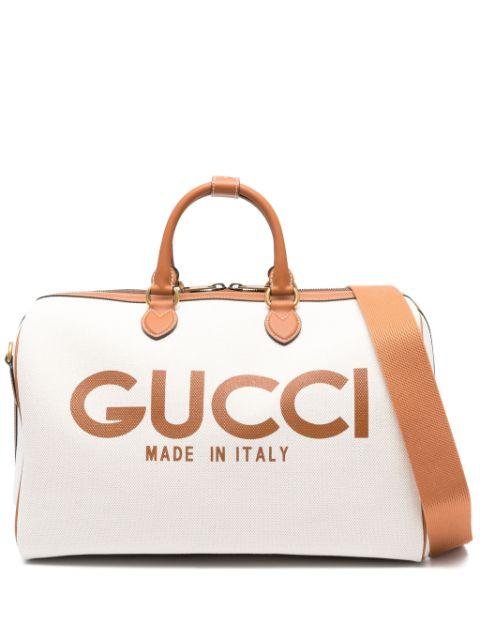 logo-print canvas holdall by GUCCI