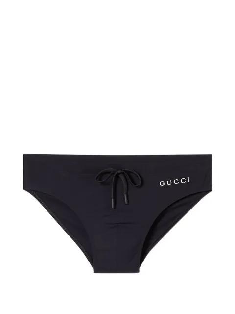 logo-print swim briefs by GUCCI