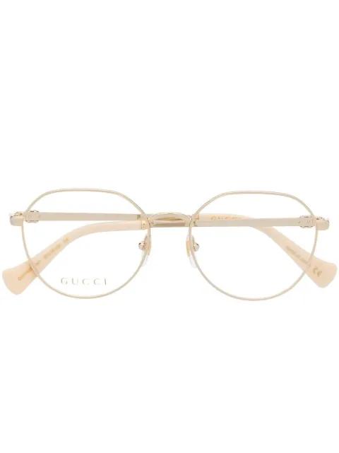 metallic round-frame glasses by GUCCI