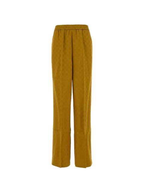 monogram-patterned trousers by GUCCI