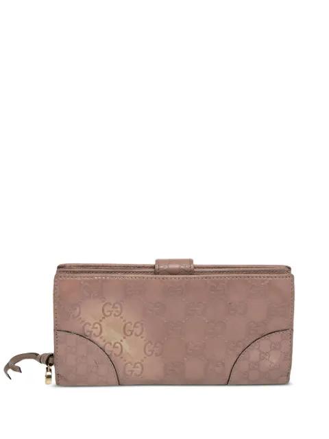 monogrammed leather wallet by GUCCI 