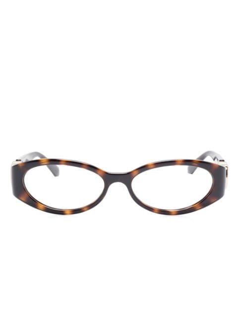oval-frame glasses by GUCCI