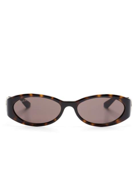oval-frame sunglasses by GUCCI