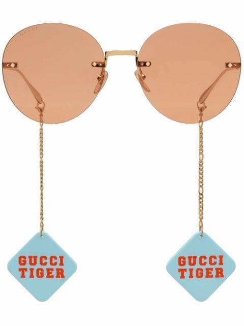 round-frame logo-charm sunglasses by GUCCI
