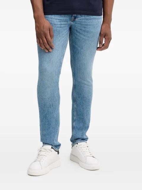 Finnley logo patch jeans by GUESS USA