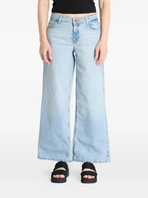 G11 faded-wash jeans by GUESS USA