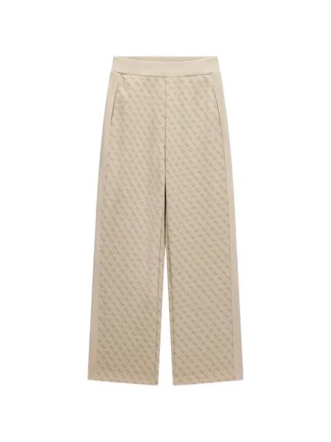 logo patterned trousers by GUESS USA