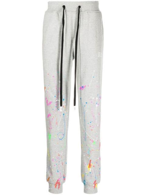 paint-splatter drawstring track pants by HACULLA