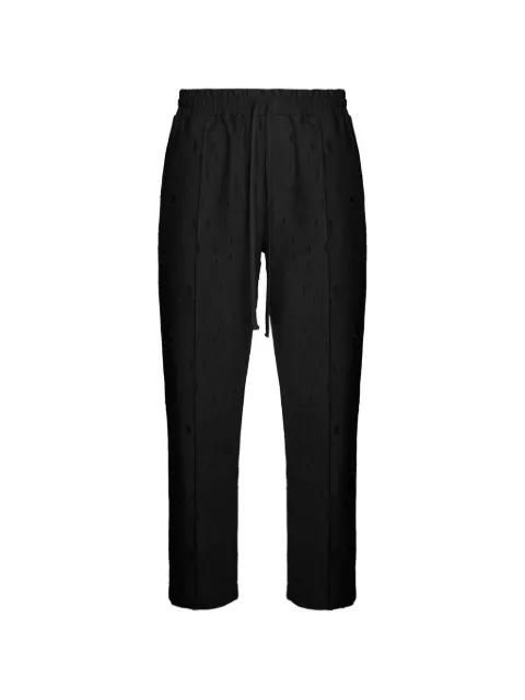 Ten distressed trousers by HAMZA