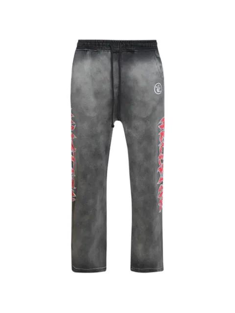 Stars Shine graffiti-print track pants by HELLSTAR