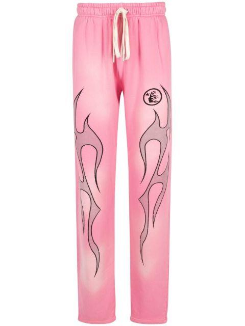 flame-print track pants by HELLSTAR