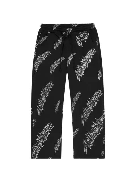 graffiti-print track pants by HELLSTAR